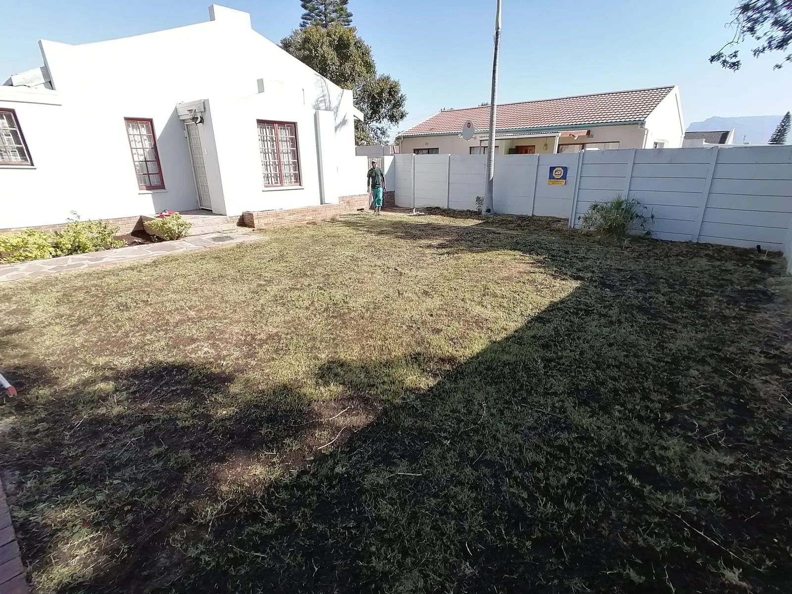 A freshly cut lawn after a garden cleanup